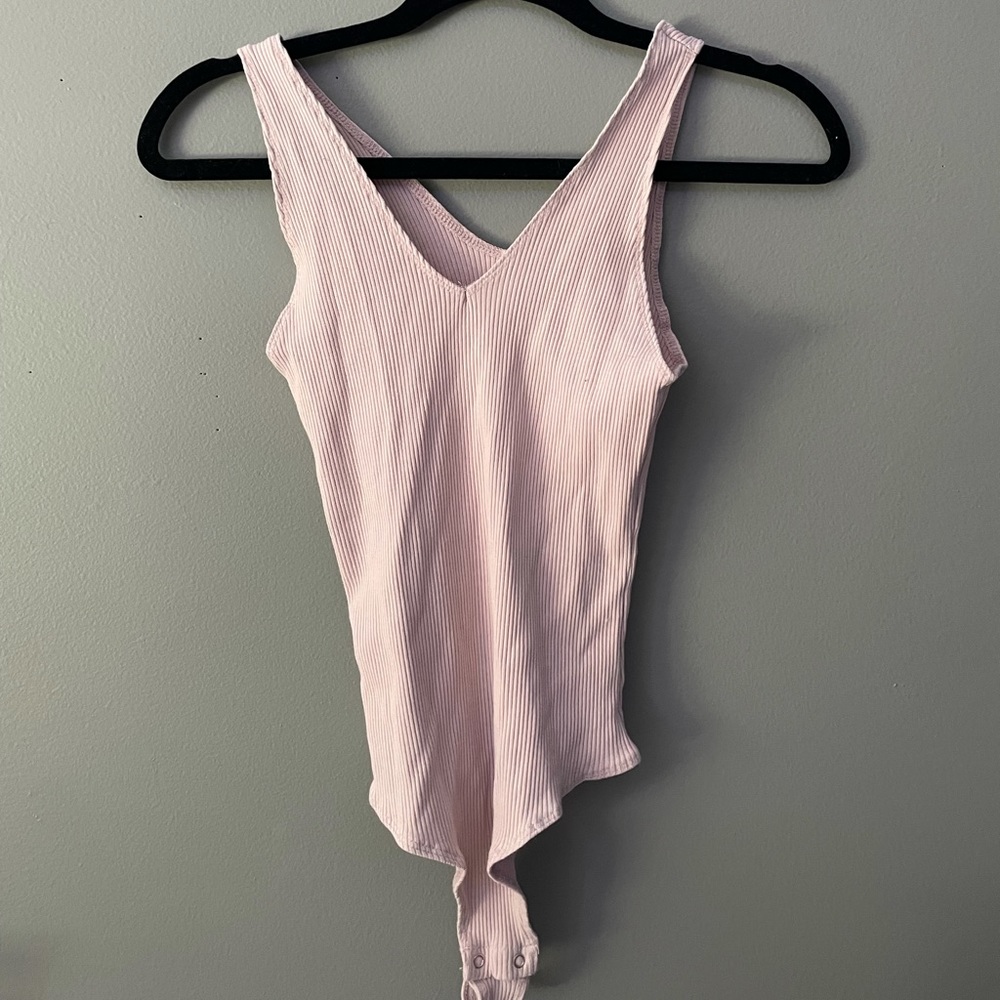 Pink body suit